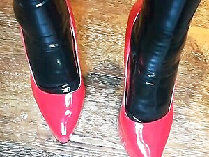 Alice Latexy models in stilettos and black and red latex (aka Latexdesires)
