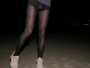 shiny black high waist pantyhose on night beach