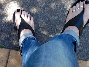 crossdresser walks around the neighborhood and shows his feet